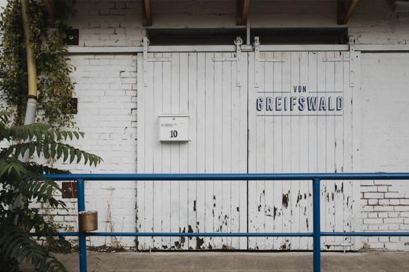 The white wooden doors of Von Greifswald at number 10